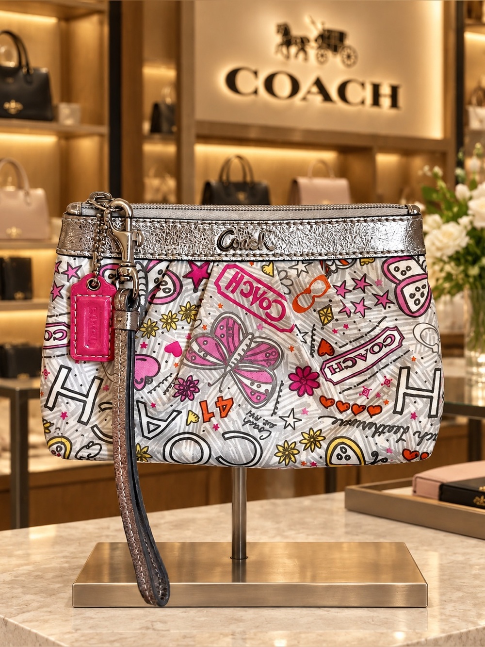 COACH Poppy Silver Graffiti Butterfly Wristlet with Pink Tag